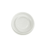 White ceramic grater by KYOCERA, showcasing its smooth surface and sharp edges for efficient food grating and zesting.