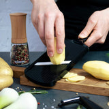 Kyocera 4-stage ceramic planer in black with adjustable blades and textured grip, ideal for woodworking and carving projects.