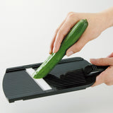KYOCERA ceramic 4-stage hobel in black, showcasing its textured surface and adjustable settings for precise slicing.