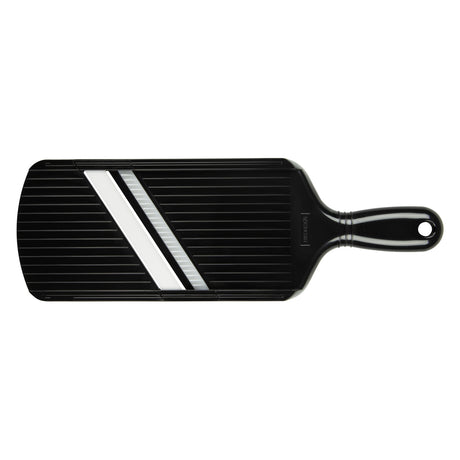 KYOCERA black julienne vegetable peeler hobel with stainless steel blade for preparing garnishes and salads.