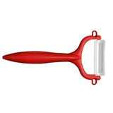 KYOCERA double-sided green vegetable peeler with sharp blades for efficient peeling and handling in the kitchen.
