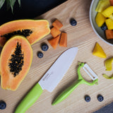 Kyocera double-sided green vegetable peeler with sharp dual blades for efficient peeling and easy kitchen use.