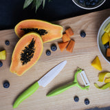 KYOCERA green ceramic knife with a sleek handle, designed for precise slicing and cutting in the kitchen.