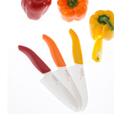 KYOCERA ceramic vegetable knife set with peeler, featuring sharp blades and ergonomic handles for precise food prep.