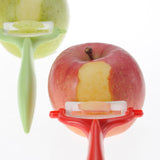 KYOCERA ceramic knife set with vegetable peeler, includes precision ceramic knives for slicing vegetables and peeling.