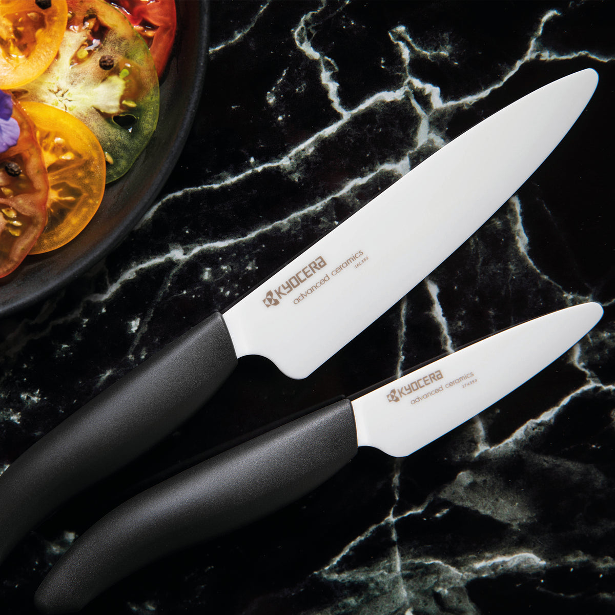 KYOCERA ceramic knife with black handle, GEN series, sharp kitchen cutting tool for precise slicing and chopping.