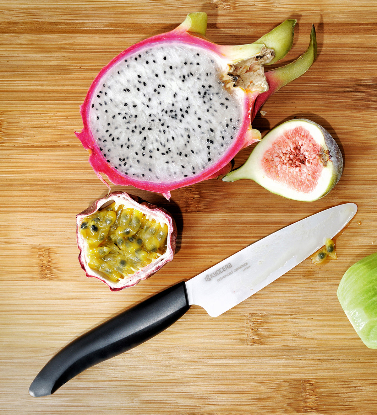 Black KYOCERA ceramic knife with sleek handle, designed for precise cutting and durability in kitchen use.