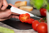 KYOCERA ceramic knife with black handle, GEN series, sharp stainless steel blade for precise cutting and kitchen prep.