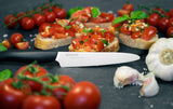 Black KYOCERA ceramic knife with a sleek handle, ideal for precise slicing and cutting in the kitchen.