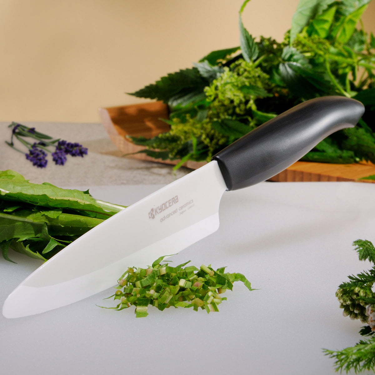 KYOCERA black ceramic knife with sleek handle, ideal for precise slicing and cutting in the kitchen.