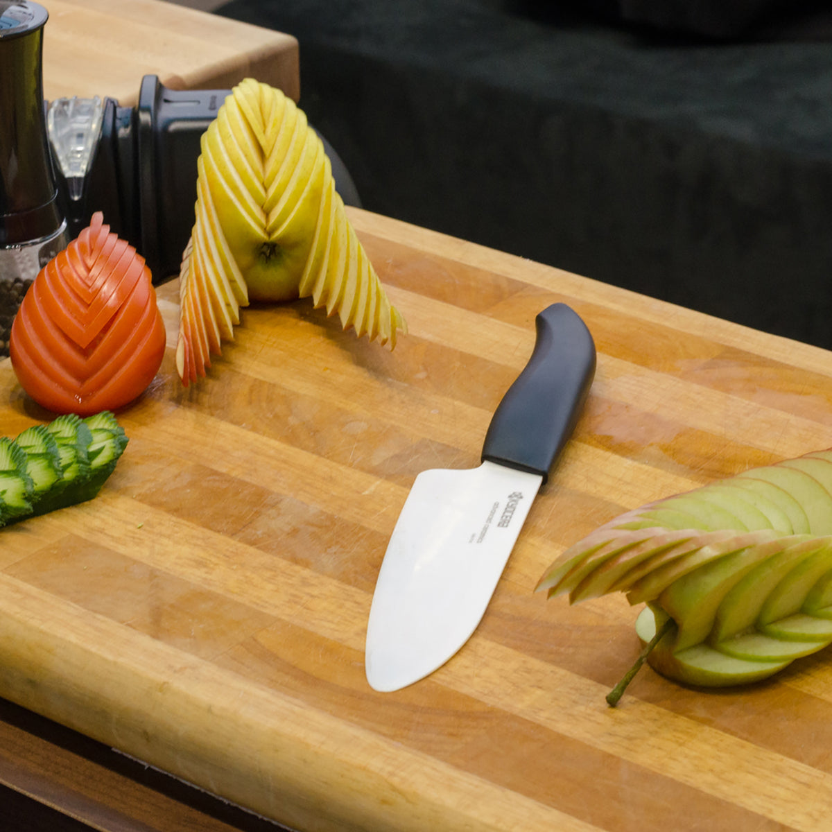 KYOCERA black ceramic kitchen knife, GEN series, sharp blade, ergonomic handle, ideal for precise slicing and cutting.