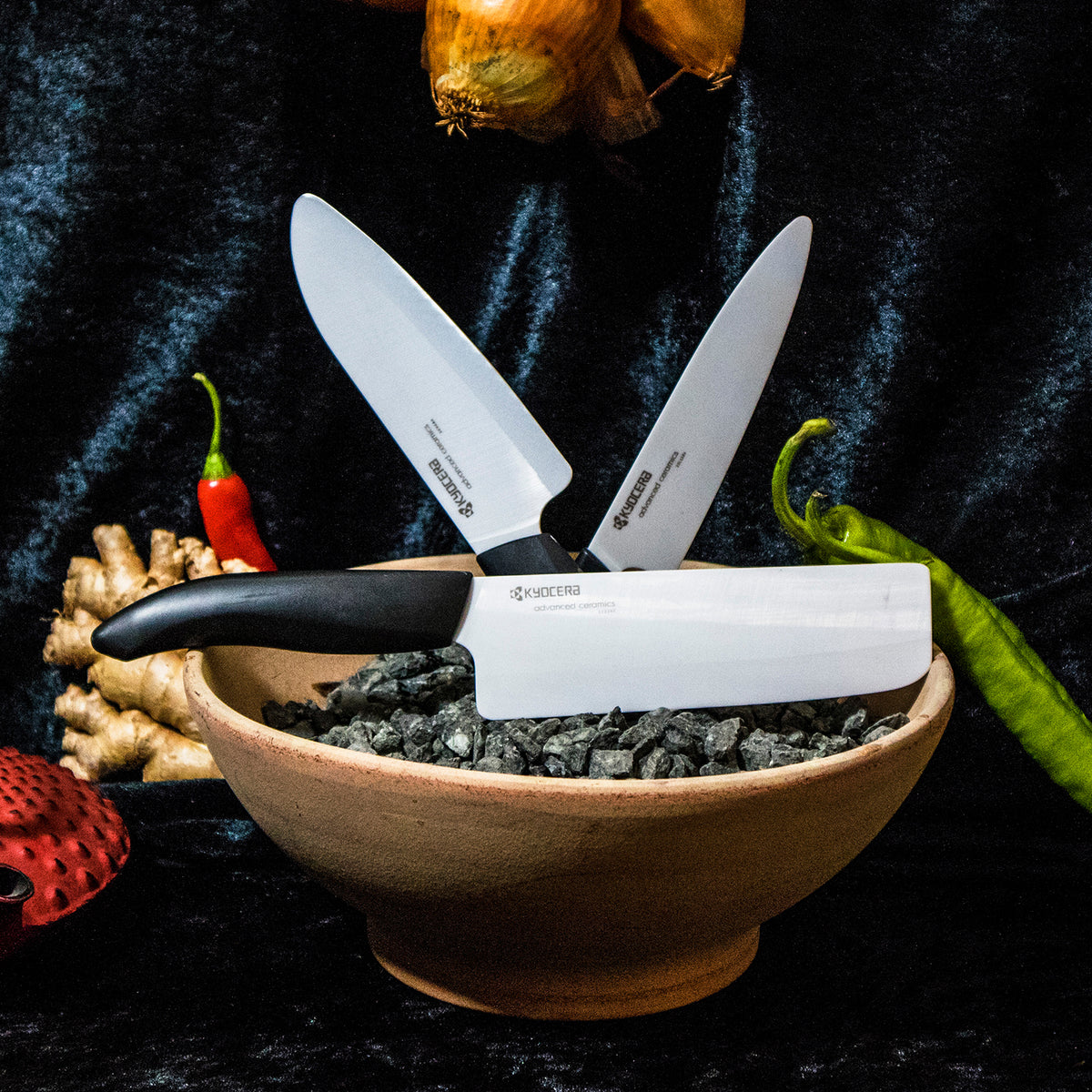 Black KYOCERA ceramic knife with a sleek handle, designed for precise cutting and durability in the kitchen.