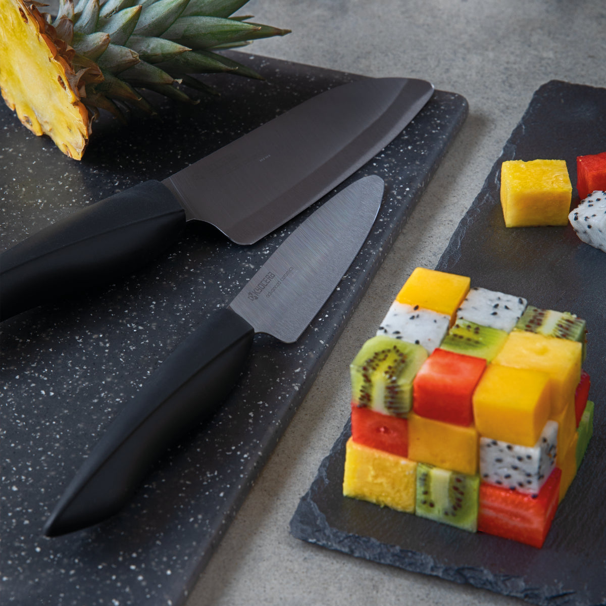 KYOCERA black ceramic knife with sleek handle, ideal for precise slicing and kitchen prep.