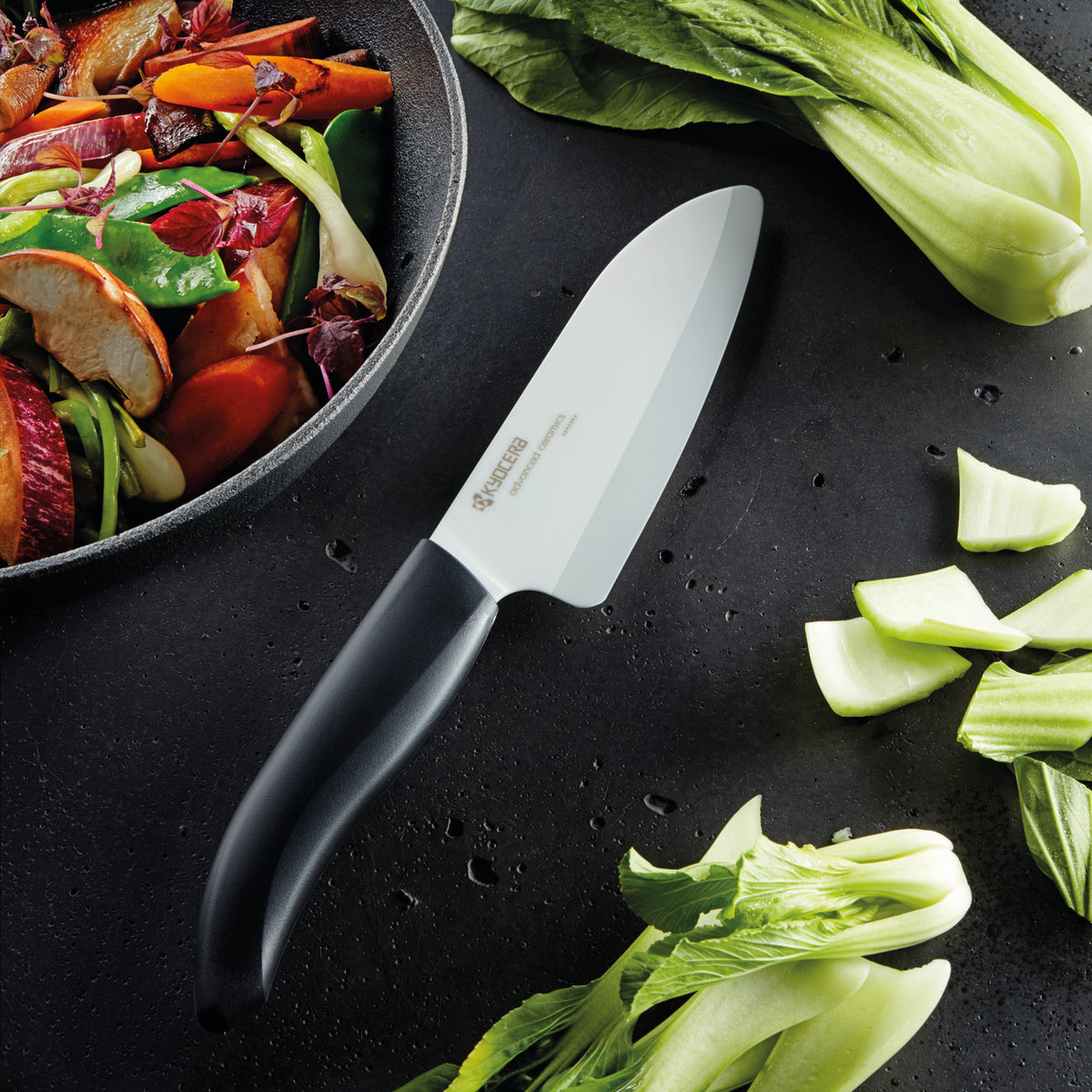 KYOCERA ceramic vegetable knife set with peeler, featuring sharp, durable ceramic blades for precise slicing and peeling.