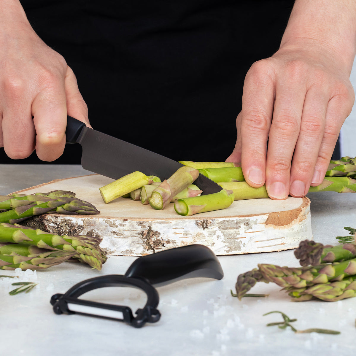 KYOCERA ceramic knife in black with a sleek handle, designed for precise slicing and cutting in the kitchen.