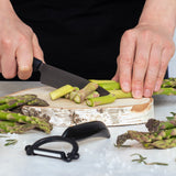 KYOCERA ceramic knife in black with a sleek handle, designed for precise slicing and cutting in the kitchen.