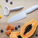 KYOCERA ceramic paring knife with white handle and blade, ideal for precise slicing and kitchen prep.