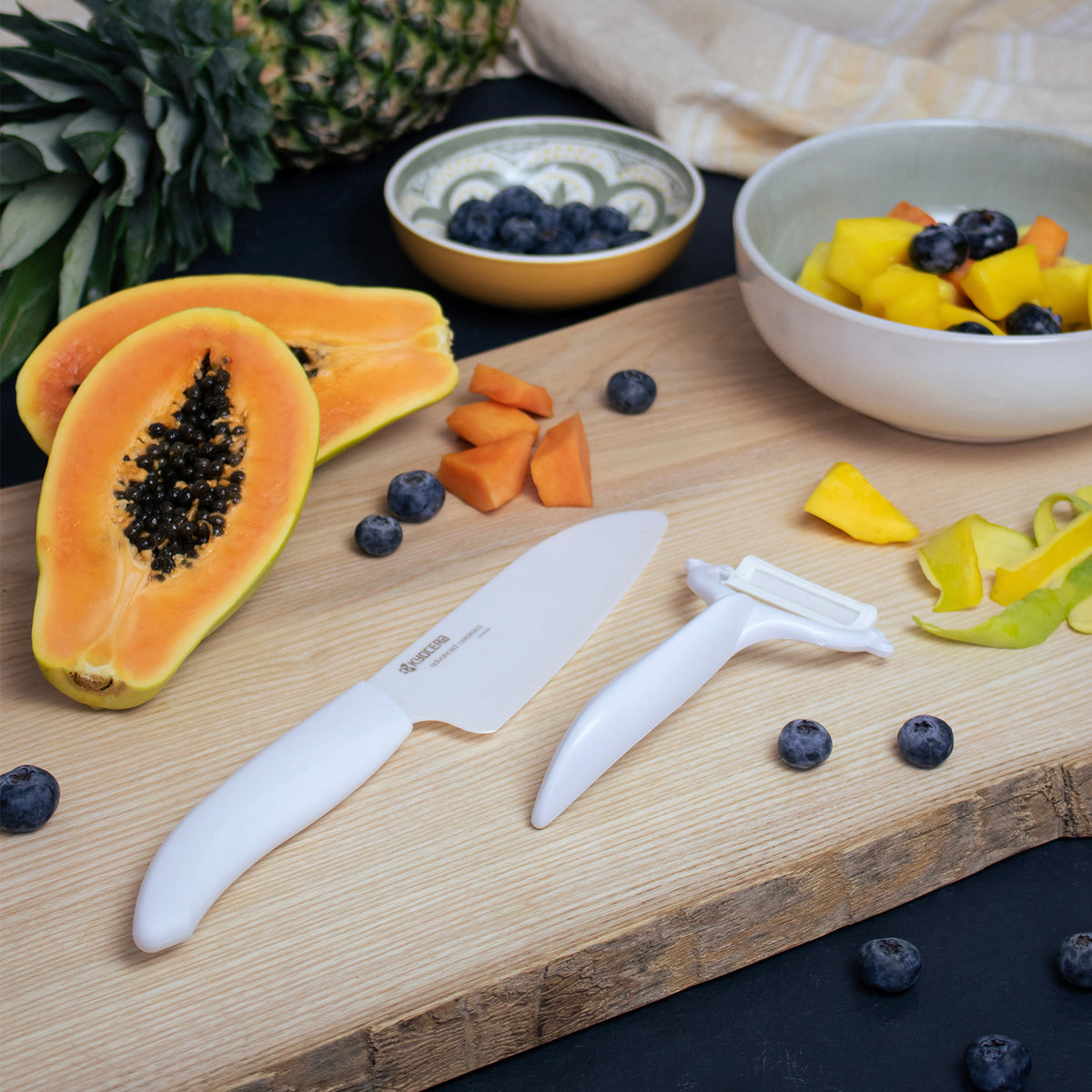 KYOCERA double-sided green vegetable peeler with sharp dual blades for efficient peeling.