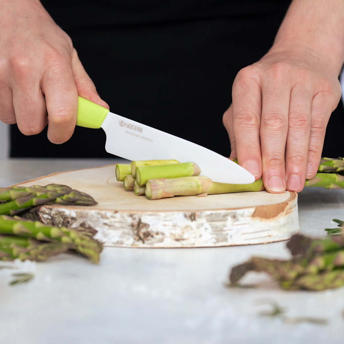 KYOCERA GEN GREEN ceramic knife with a vibrant green handle, designed for precise slicing and cutting in the kitchen.
