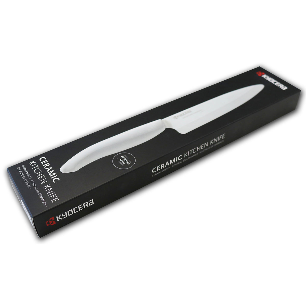KYOCERA ceramic peeling knife with white handle and sharp blade, ideal for precise kitchen peeling tasks.