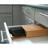 KYOCERA 3-in-1 bamboo knife block with multiple slots for kitchen knives and utensils, showcasing its sleek, natural design.