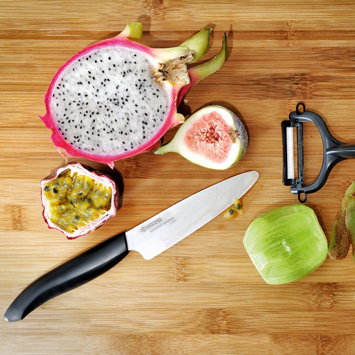 Kyocera ceramic knife set with vegetable peeler, includes a precision ceramic paring knife and peeler for kitchen prep.