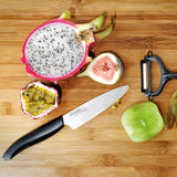 Kyocera ceramic knife set with vegetable peeler, includes a precision ceramic paring knife and peeler for kitchen prep.