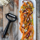 KYOCERA ceramic vegetable knife set with peeler, featuring sleek handles and sharp blades for precise kitchen prep.