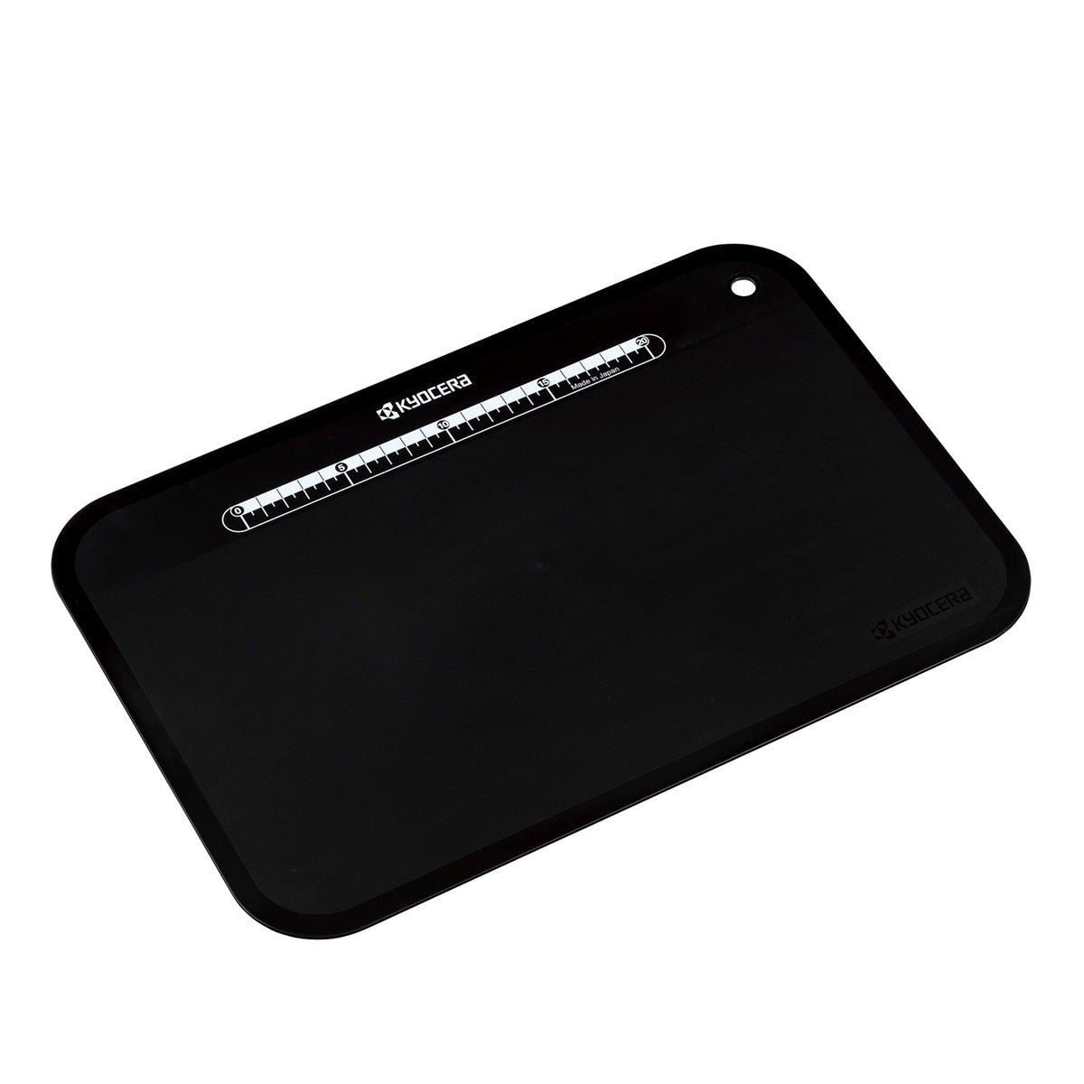 Black KYOCERA flexible cutting mat, 37 x 25 cm, designed for safe and precise food preparation and slicing.
