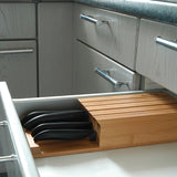 KYOCERA Messerblock with four GEN WHITE knives and bamboo stand for stylish kitchen knife storage.