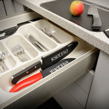 Black KYOCERA knife protector for blades up to 11 cm, designed to safely cover and protect kitchen knife edges.