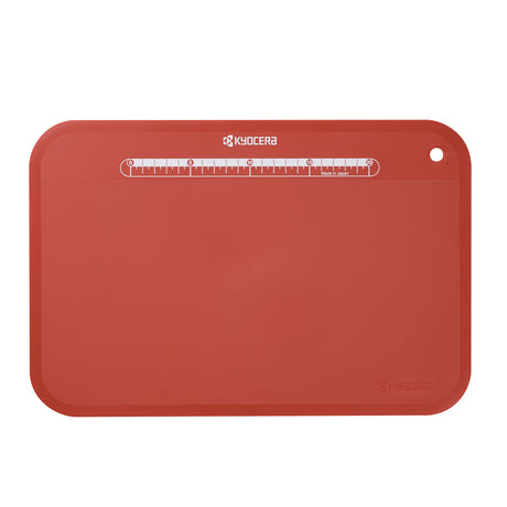 KYOCERA flexible black cutting mat, 37x25 cm, ideal for precise slicing and protecting surfaces during food preparation.
