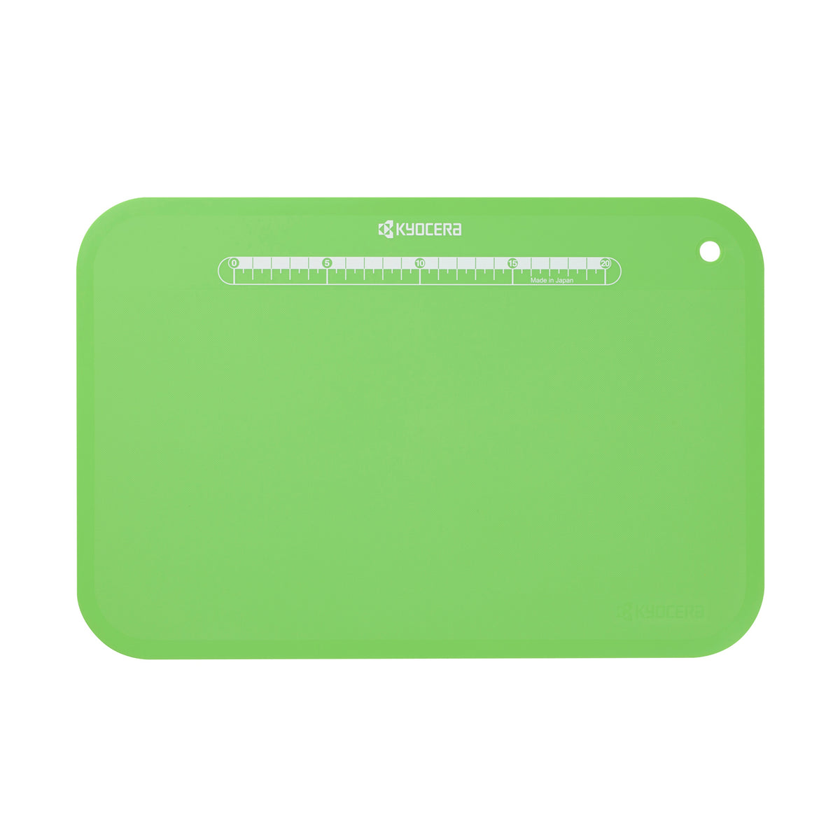 Flexible black KYOCERA cutting mat, 37 x 25 cm, used for safe and precise slicing on various surfaces.