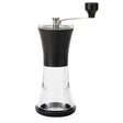Black KYOCERA ceramic coffee grinder with lid, showing the sleek, modern design and grinding chamber in close-up.