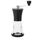 Black KYOCERA ceramic coffee grinder with lid, showing the sleek, modern design and grinding chamber in close-up.