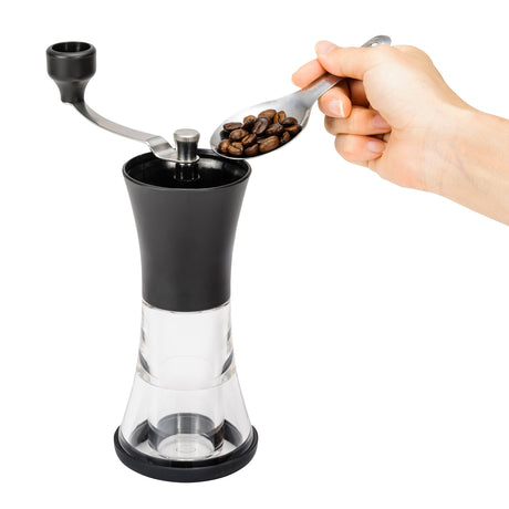 KYOCERA black ceramic coffee grinder with lid, compact and sleek, ideal for fresh coffee beans grinding.