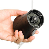 Black KYOCERA ceramic coffee grinder with lid, showing the textured ceramic grinding mechanism and sleek modern design.