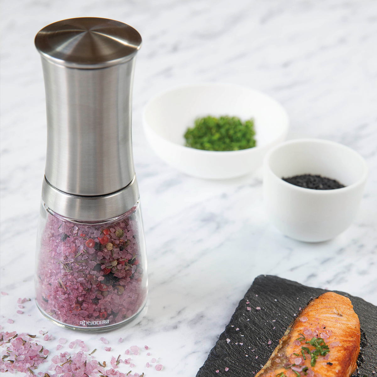 KYOCERA ceramic universal mill with a 16 cm size, featuring a sleek design for grinding spices and herbs.