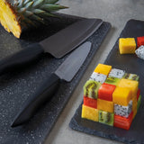 KYOCERA SHIN black ceramic knife with sleek handle and sharp blade, ideal for precise cutting and slicing in the kitchen.