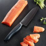 KYOCERA ceramic knife SHIN with black handle, showcasing its sleek design and sharp blade for precise cutting.
