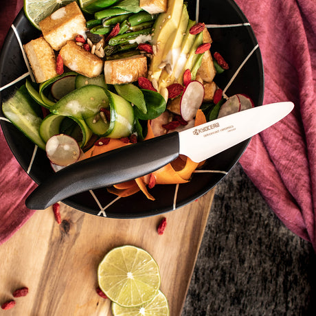 KYOCERA GEN NATURE black ceramic knife with sleek handle and sharp blade for precise cutting and kitchen use.