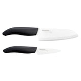 KYOCERA ceramic knife set with a peeling knife and santoku knife displayed on a kitchen countertop.