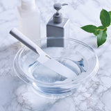 KYOCERA white ceramic knife, CHOWA model, with a sleek handle and sharp blade for precise cutting.