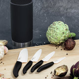 KYOCERA knife block with four GEN soft-touch knives, sleek black design for safe and easy kitchen use
