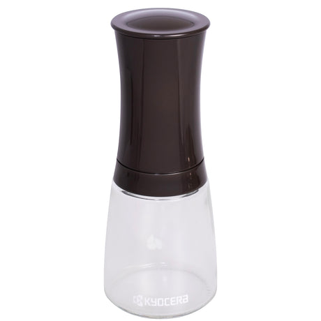 KYOCERA ceramic pepper grinder in dark brown, 16 cm tall, with textured ceramic grinding mechanism for fresh spice grinding.