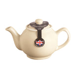 Cream-colored P & K Teekanne teapot with a classic design, featuring a lid and spout, on a neutral background.
