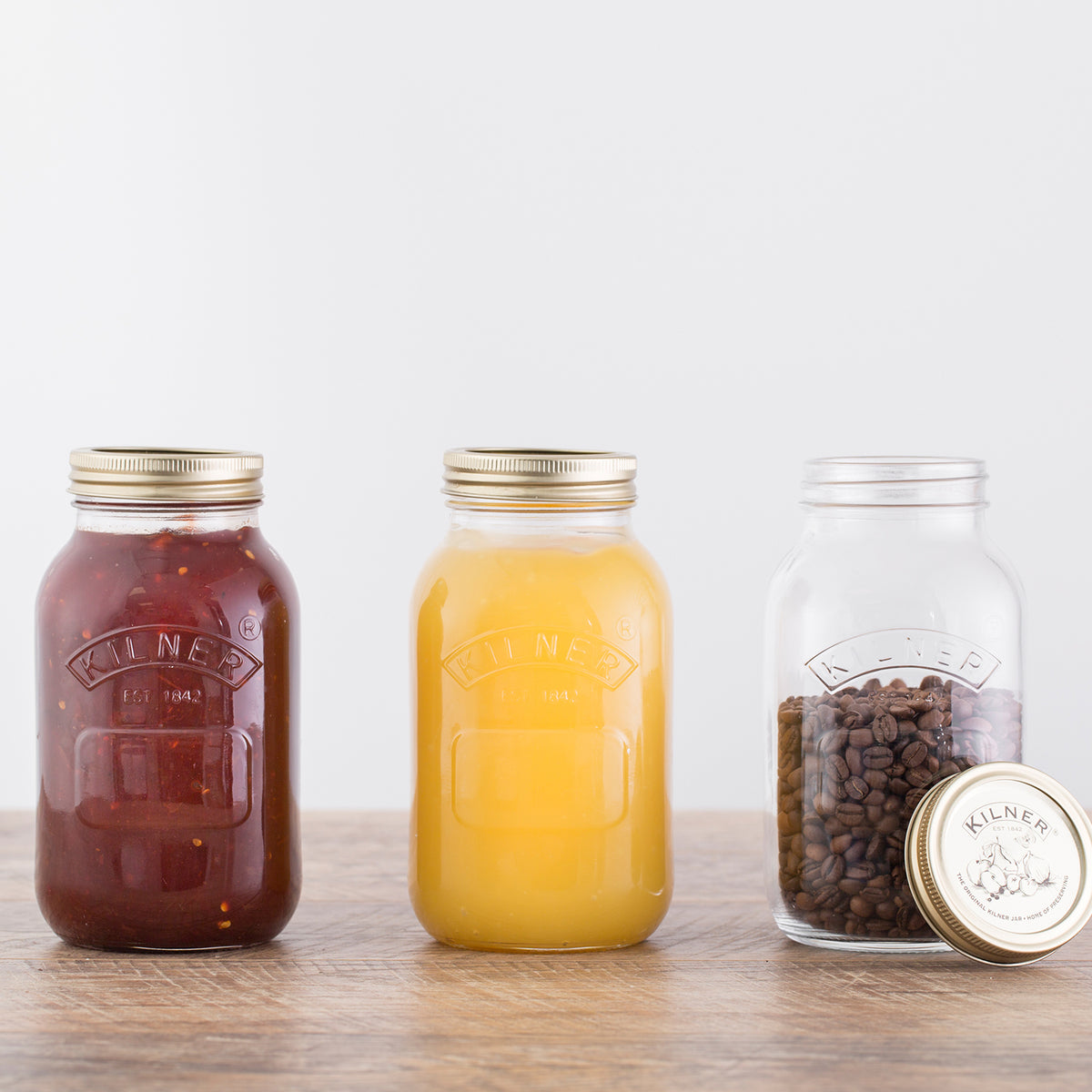 Clear 1L KILNER screw-top glass jar for canning and storage, with a wide mouth and metal lid, ideal for preserving food.