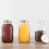 Clear 1L KILNER screw-top glass jar for canning and storage, with a wide mouth and metal lid, ideal for preserving food.