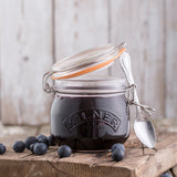 Clear KILNER clip round canning jar for preserving food, with a secure metal clip lid and transparent glass body.