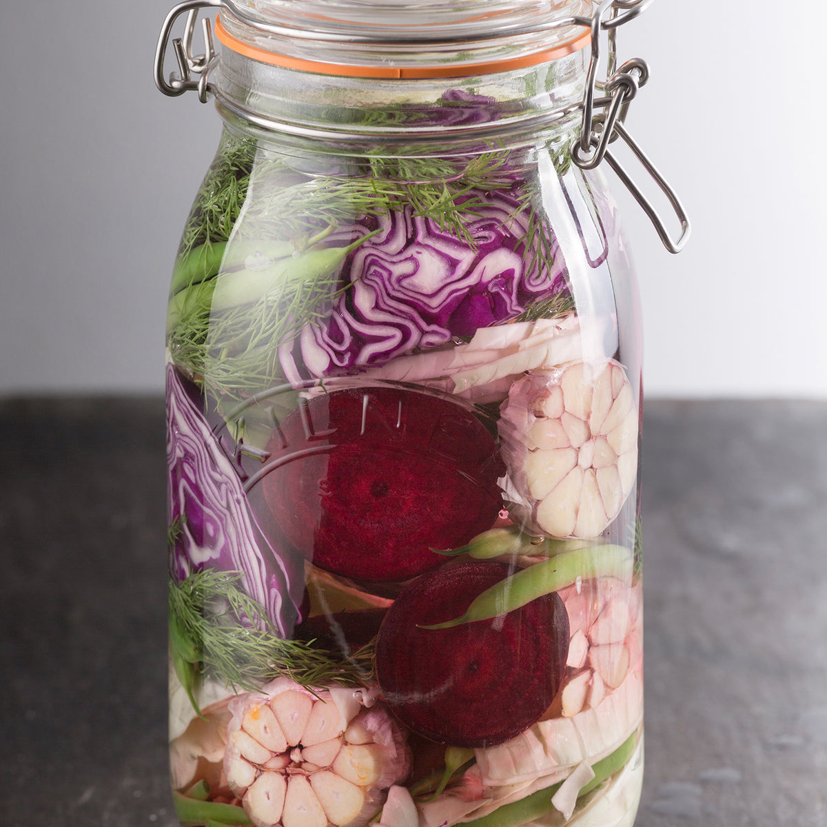 Clear Kilner Clip Round canning jar with metal clamp lid for preserving food and storing items.